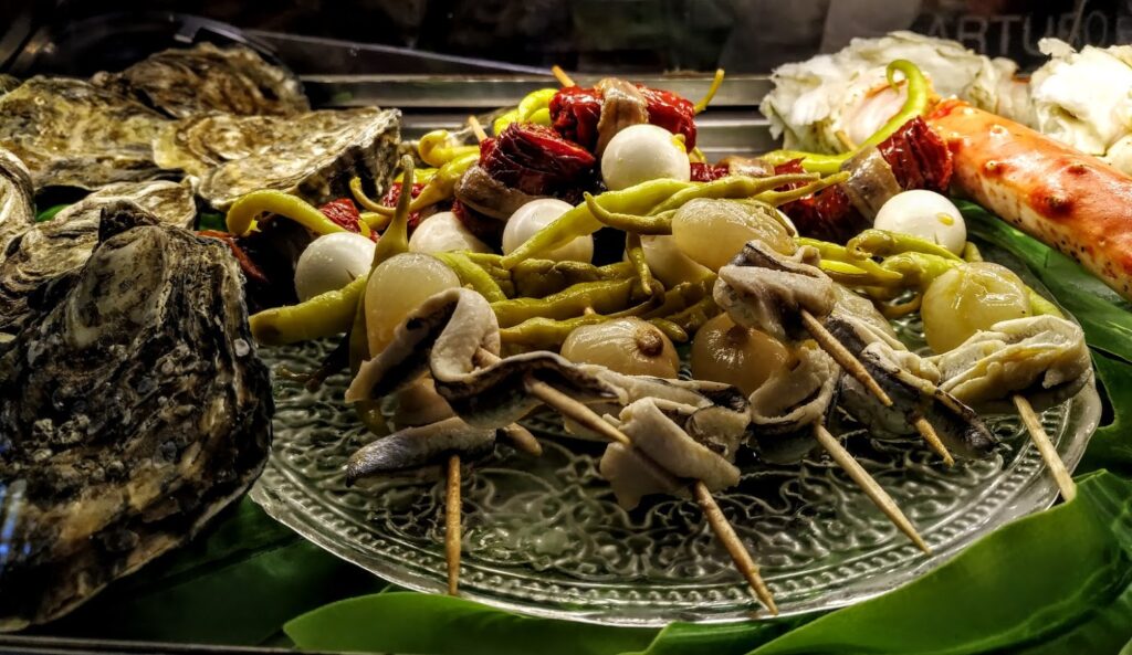 Gastrobar El Laurel Mollejitas de cordero teriyaki sobre pastel de parmesano